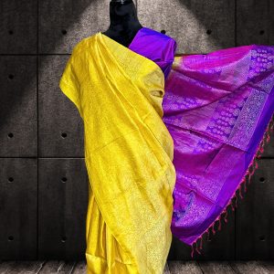 yellow Kanchipuram silk saree with purple anchal and plain body