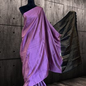 unique purple Kanchipuram silk saree with weaved golden stripes on body and black golden pallu