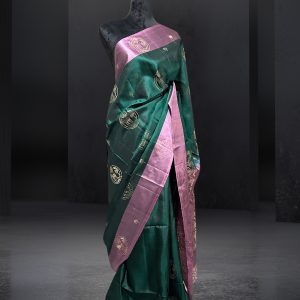 exclusive green Kanchipuram silk saree with unique pink border and anchal