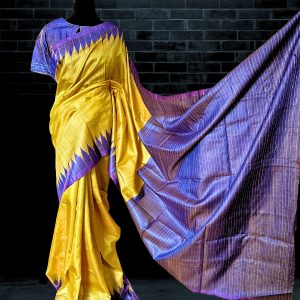 yellow Tussar silk saree with blue anchal weaved with striped pattern by weavers of Odisha